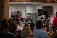 a group of people in a kitchen